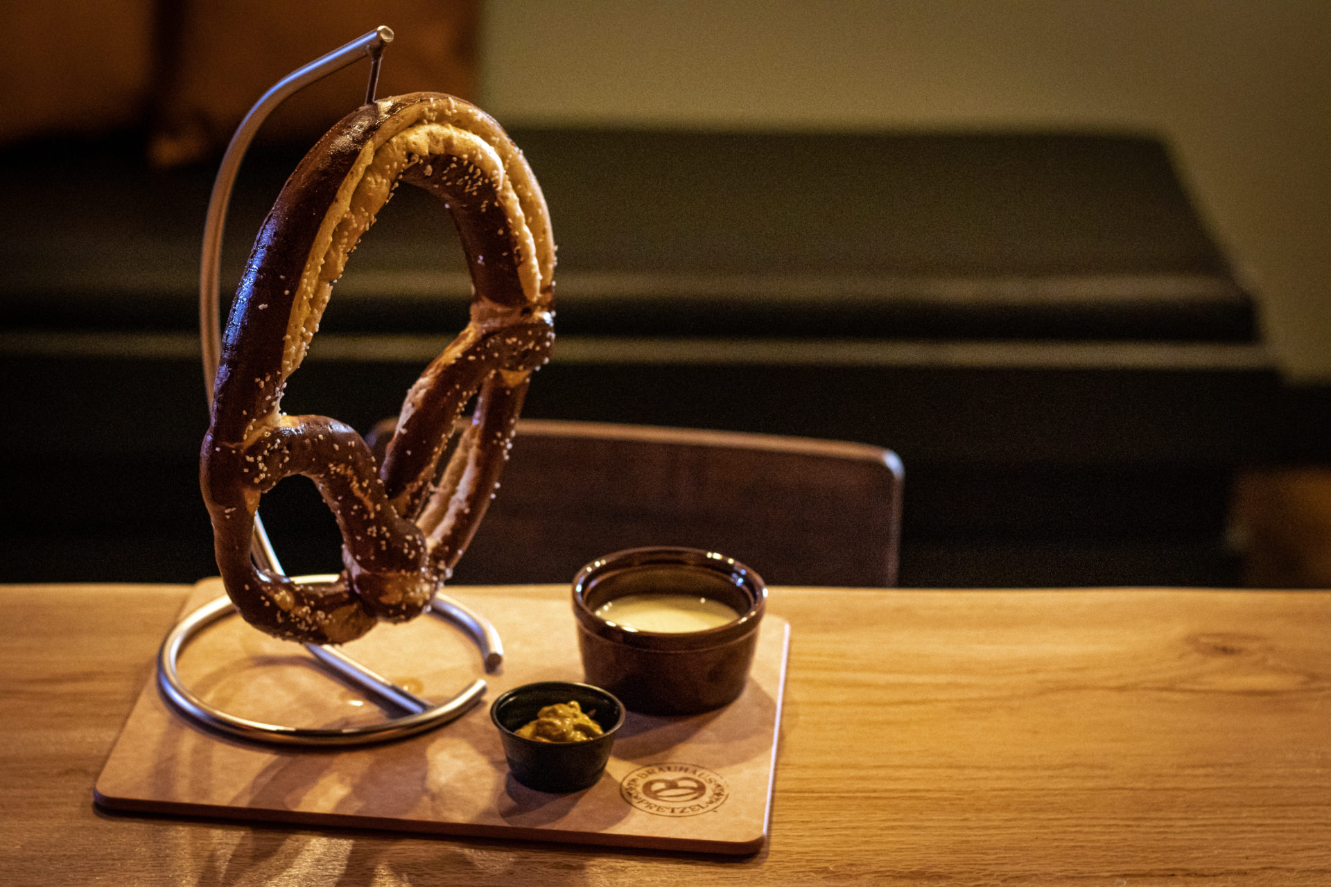 German Pretzel hanging on a stylish stand at The Legendary Axe throwing ann arbor.