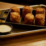 Lumberjack Tots served with mayo at the Legendary Axe throwing ann arbor.
